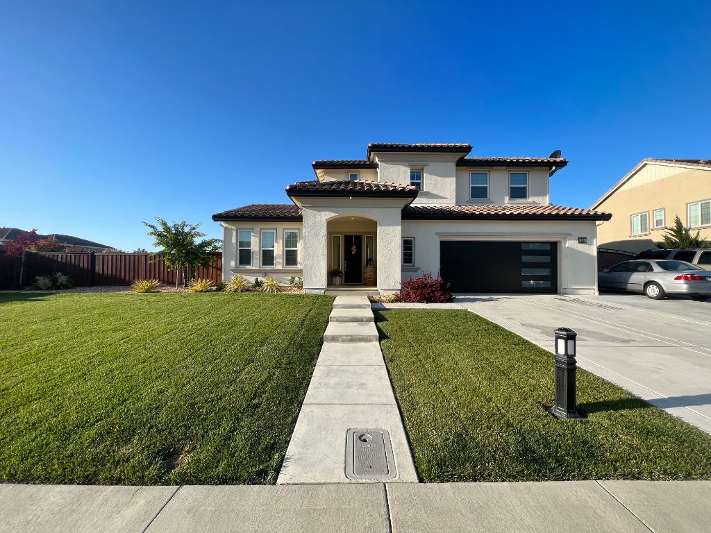 White stucco home freshly repainted — Milestone Painting exterior, Vacaville CA