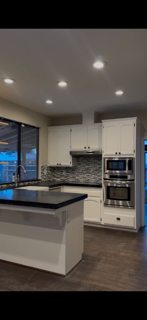 After: Stunning kitchen with freshly painted white cabinets