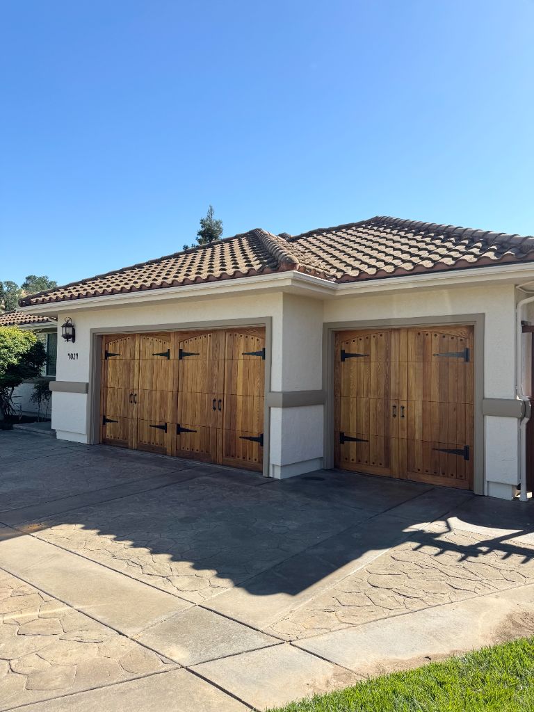 Beautifully stained wood garage doors with rich natural finish